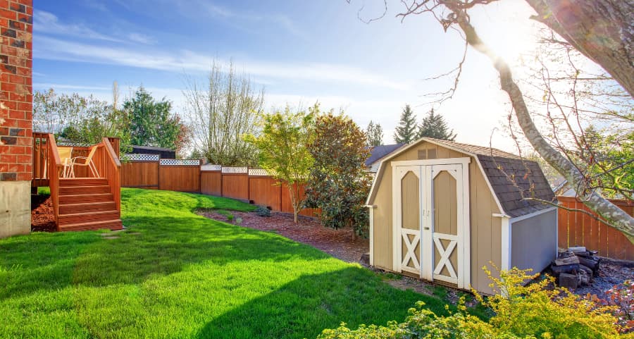 Fenced backyard with storage shed in Boise